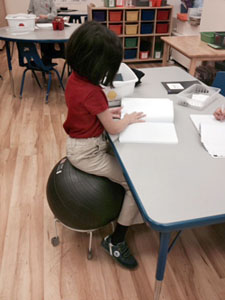 Improved posture and increased attention are benefits of the AlertSeat™ that teachers and therapists at The IDEAL School value.